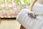 Spring Cleaning Spring flowers and chair with fresh towels