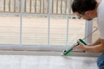 35597 9 Man sealing screendoor