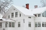 Energy efficient home with snow covered roof
