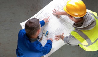 CreateEnergyEfficientHome Architect and builder looking over a home's blueprints.