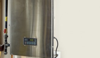 A tankless hot water heater with digital display.