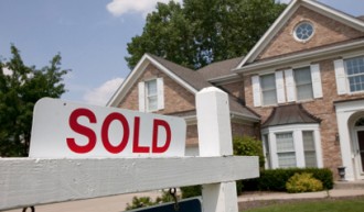 Sold sign on energy efficient house