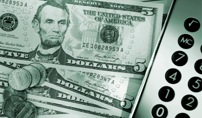picture of dollar bills, coins and a calculator