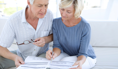 older couple looking at a report